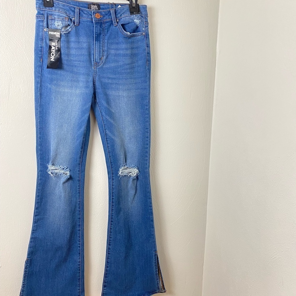 Flare Super High Rise Faded Distressed Jeans by Simply Society. Blue. Size  5/27